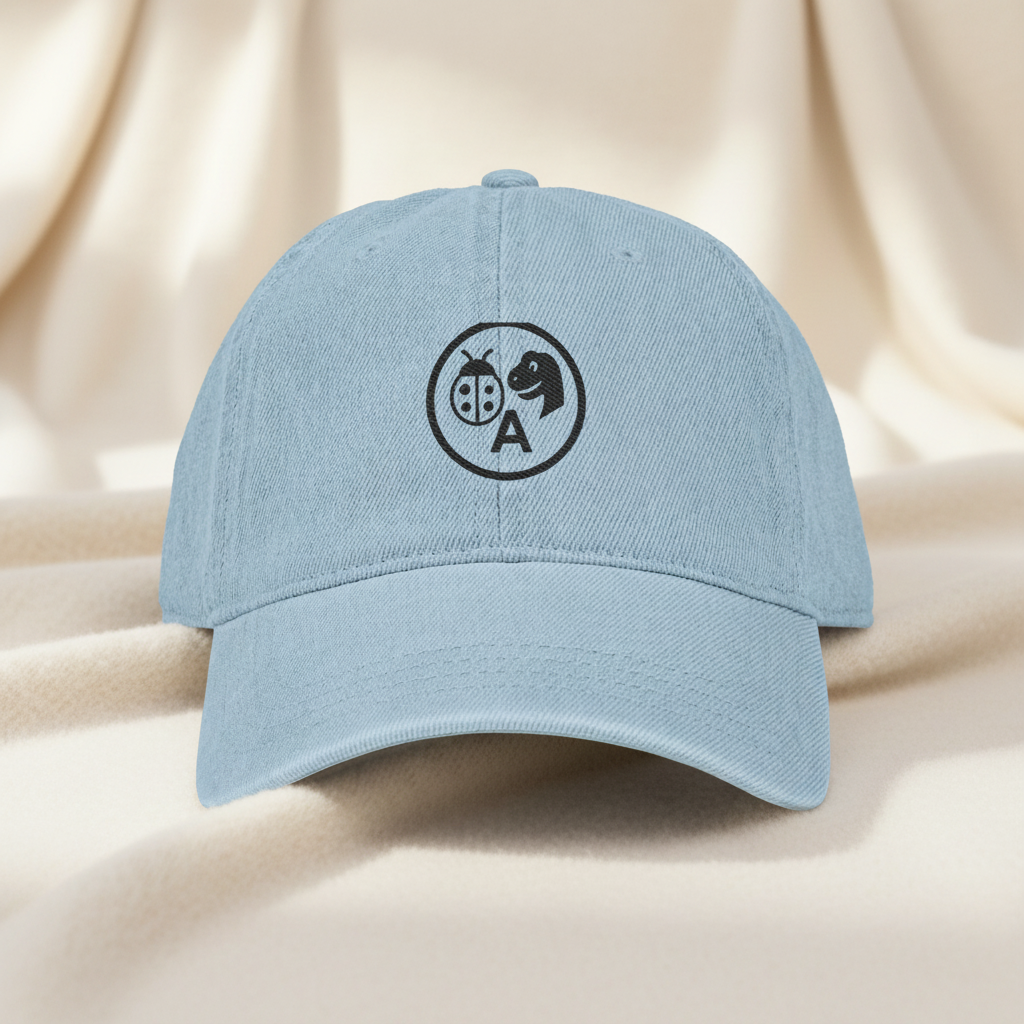 Light Blue Hat on Cream Blanket